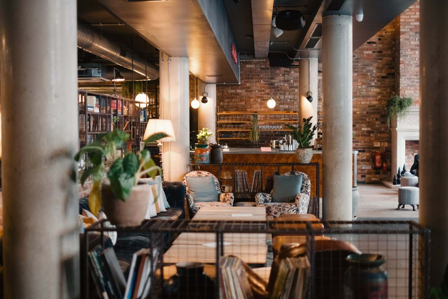 A hotel interior featuring a cosy and industrial reception