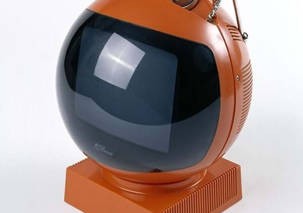 Retro orange spherical television with antenna and control knobs.