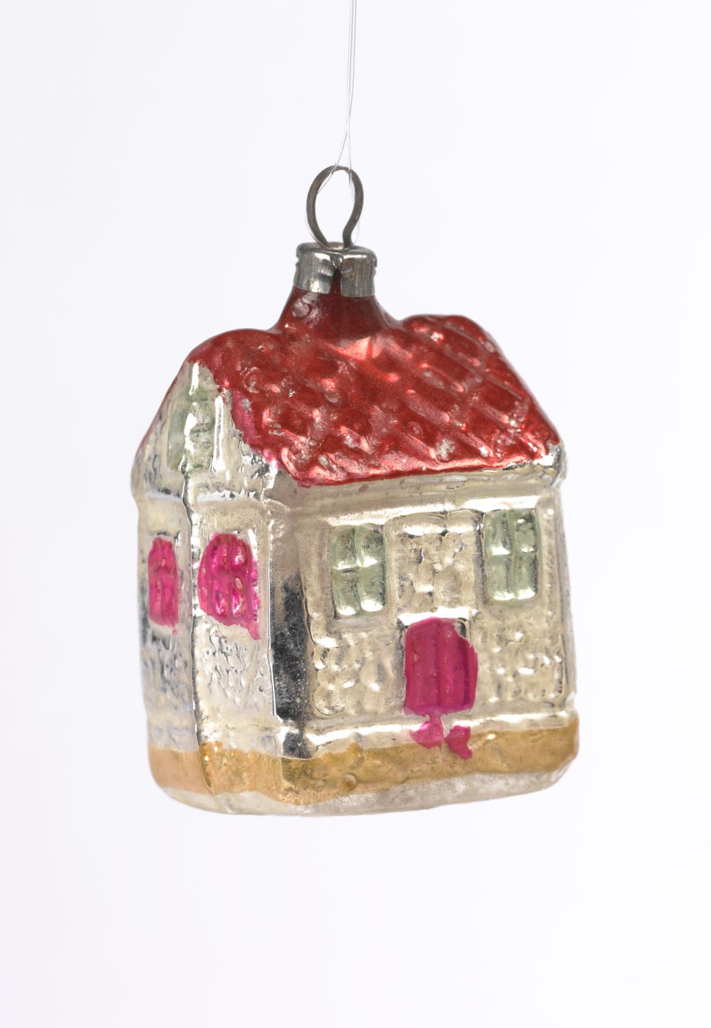 Vintage glass Christmas ornament shaped like a small house with red roof and painted details
