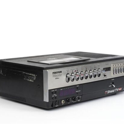 A vintage Ferguson Videostar deluxe audio stereo unit with numerous buttons and dials, including a cassette player and tuning display, photographed against a plain white background.
