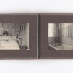 Open vintage soft brown cloth photo album showing sepia toned photos: a tea-set table before a plate-laden sideboard on the left, and a bathtub with two towels on rails and a window on the right.