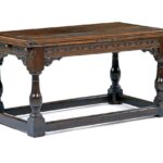 Dark oak table with turned legs and stretcher base