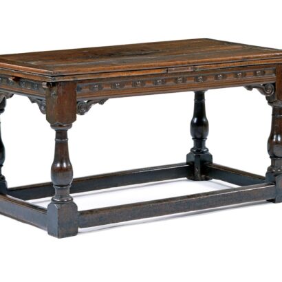 Dark oak table with turned legs and stretcher base