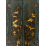 Blue-green corner cabinet with gold decorative scenes in imitation of East Asian lacquer.