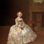 Portrait painting of a woman in a white and gold embroidered dress sitting beside a small table.