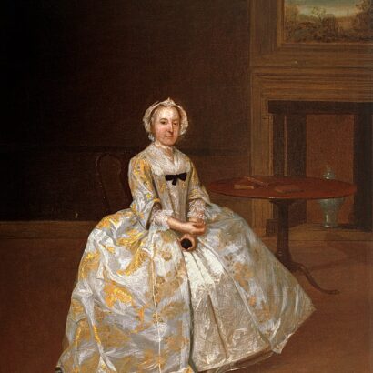 Portrait painting of a woman in a white and gold embroidered dress sitting beside a small table.