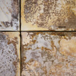 Close up of wall panels that look stained brown and white.