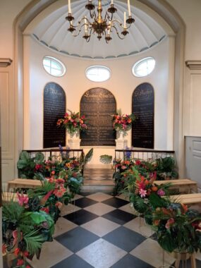 A chapel in the Museum of the Home lined with seats to create a wedding aisle
