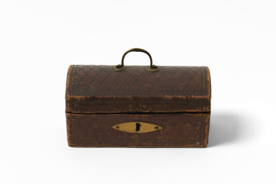 A brown, weathered box with a small handle and lock.