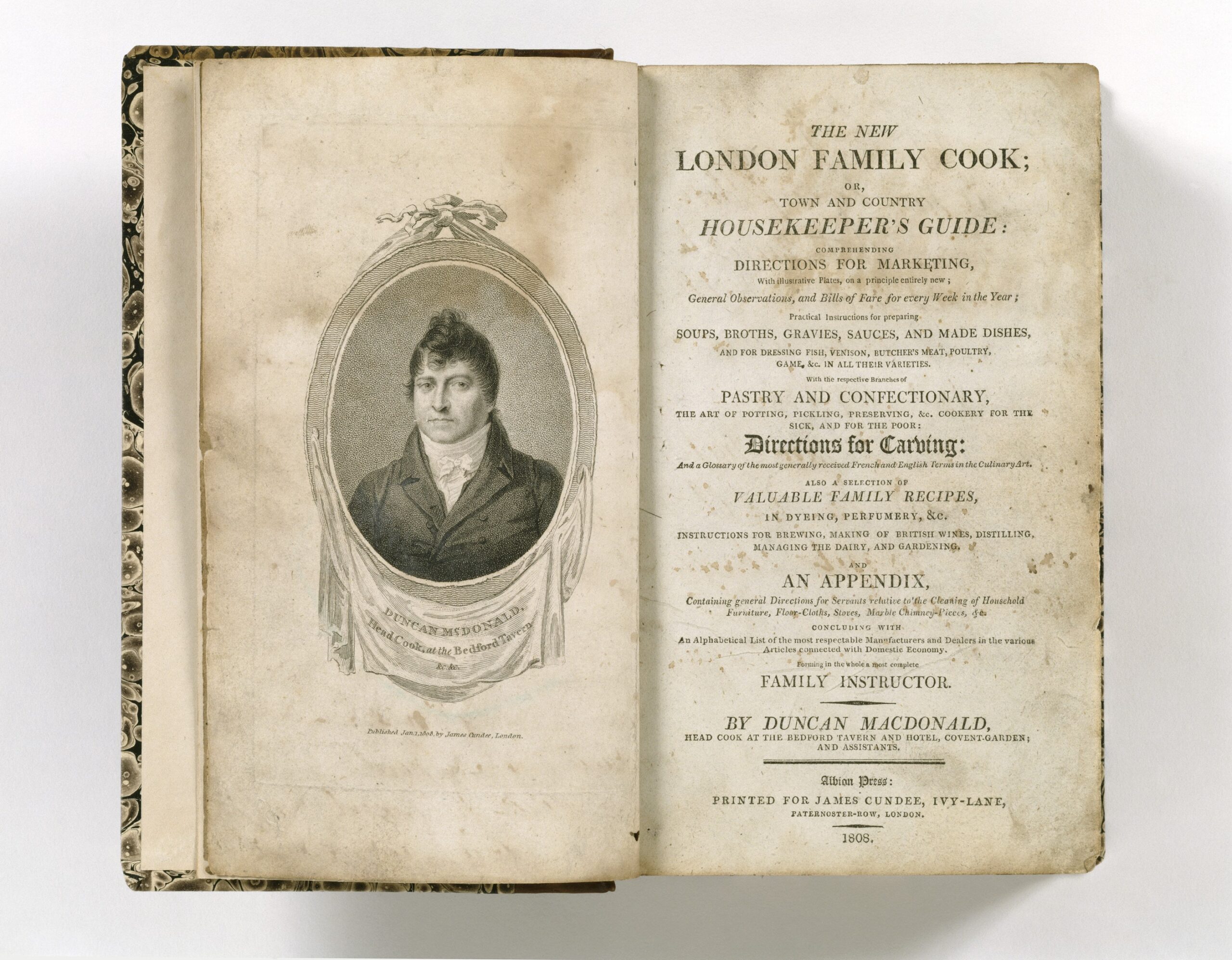 Open 1808 cookbook "The New London Family Cook" showing portrait and title page