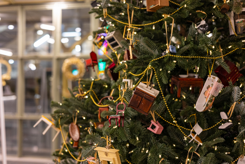 Detailed view of a Christmas tree with baubles made from dollshouse furniture