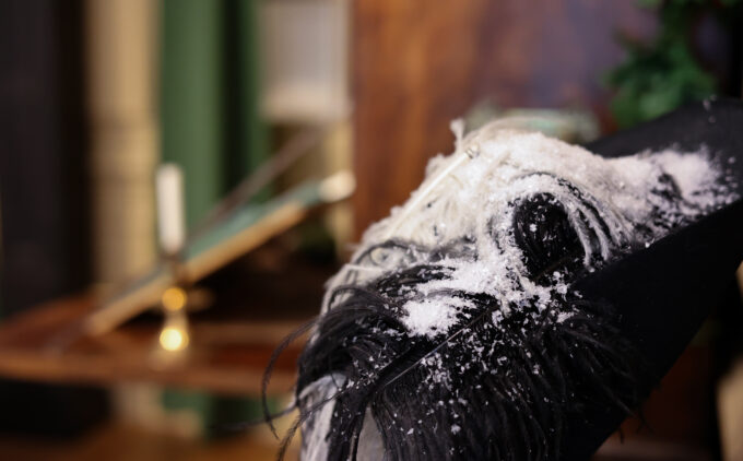 Close up view of snow frost on a dark coloured jacket