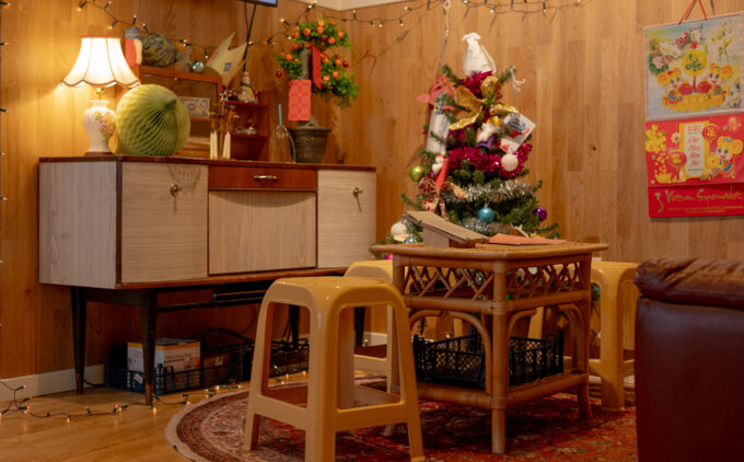 Christmas decorations in a British Vietnamese living room with Tết envelopes, Christmas lights, and more.