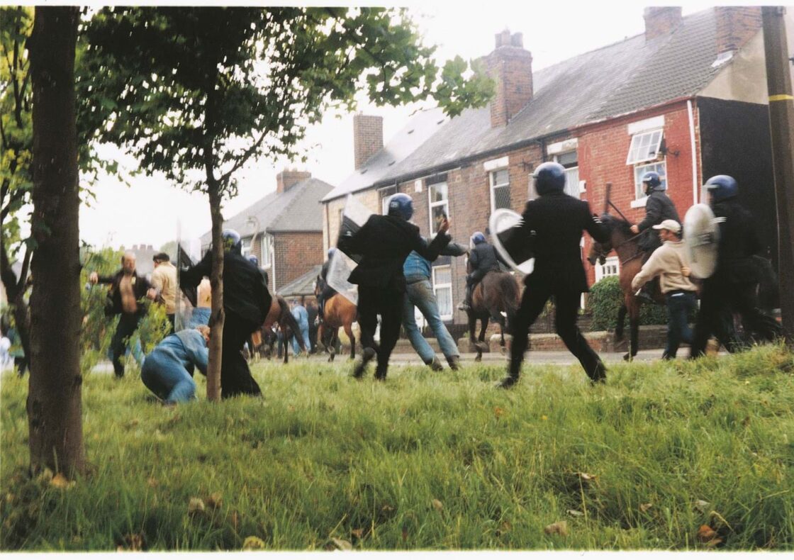 Photograph still from artist Jeremy Deller's The Battle of Orgreave (An Injury to One is an Injury to All) depicting clashes between police and protestors