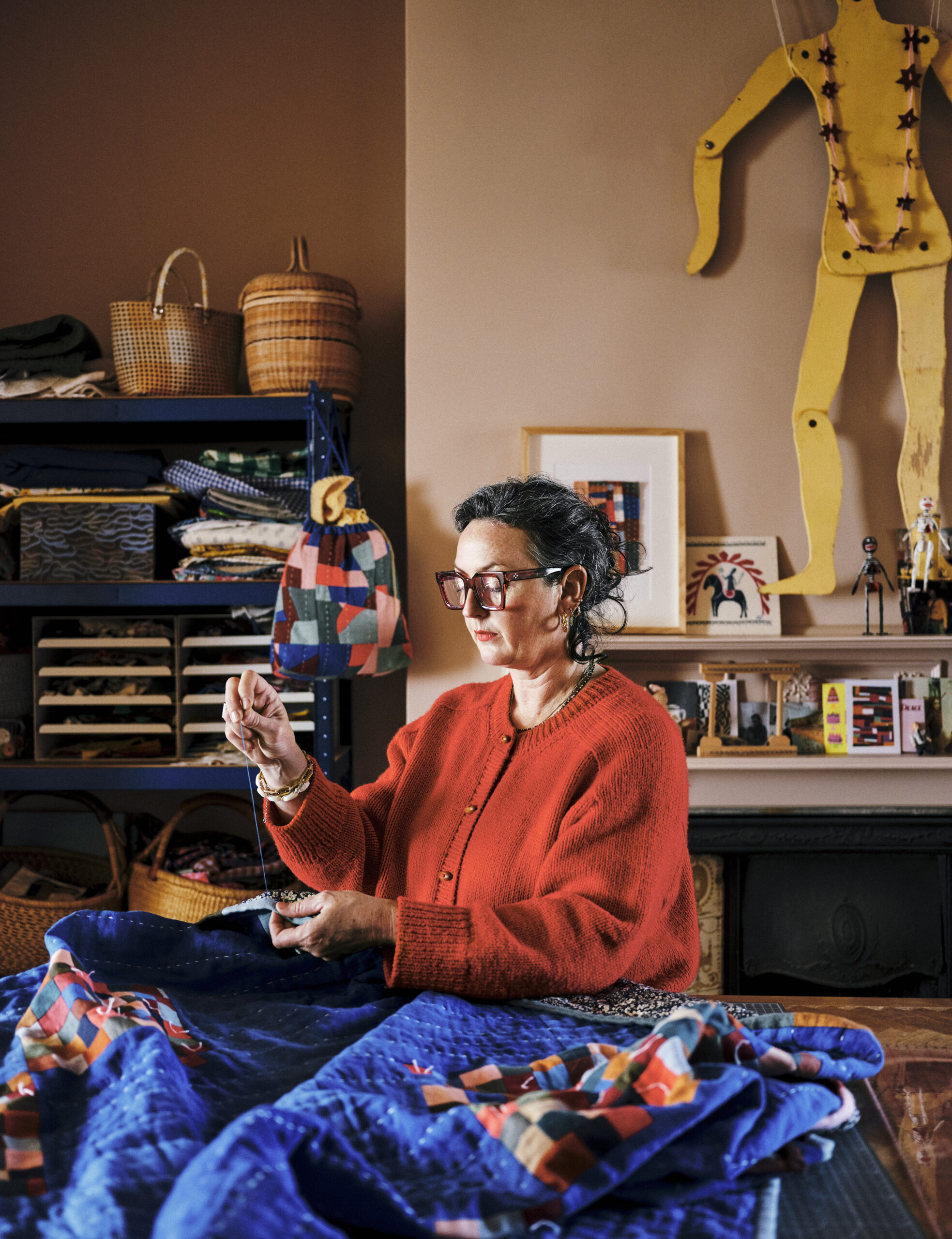 A portrait of Jessie Cutts quilting