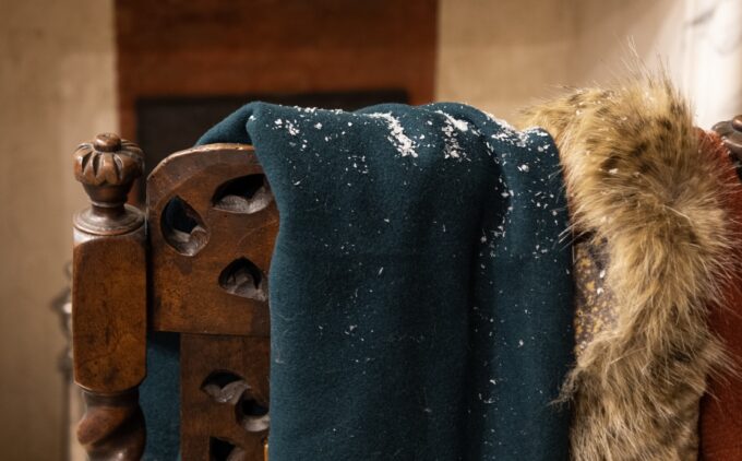 Close up view of snow frost on a dark coloured jacket