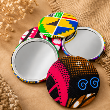 A selection of pocket mirrors with brightly designs covers